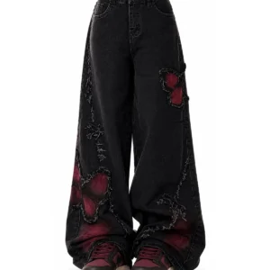 Black butterfly patch baggy jeans, front view.
