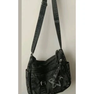 Black denim star messenger bag, front view.